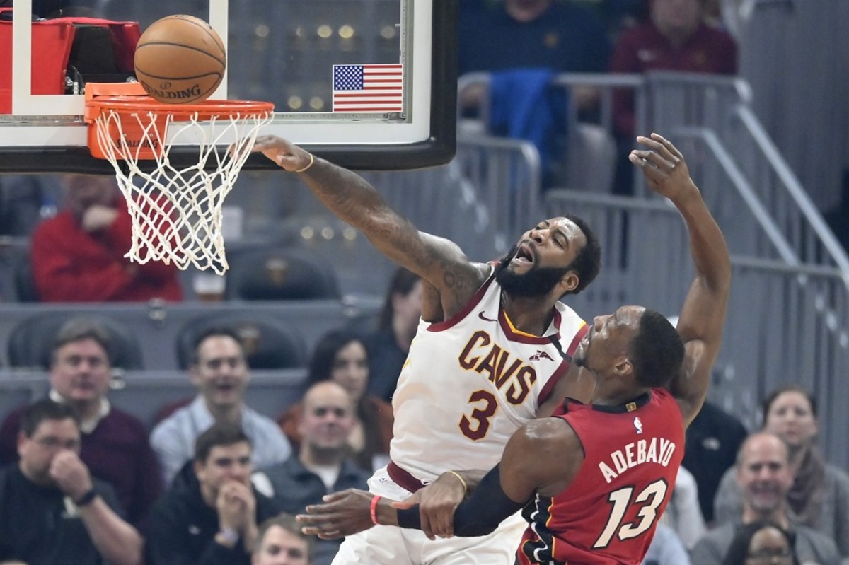 Cleveland Cavaliers center Andre Drummond misses a dunk beside Miami Heat forward Bam Adebayo in the first quarter at Rocket Mortgage FieldHouse.