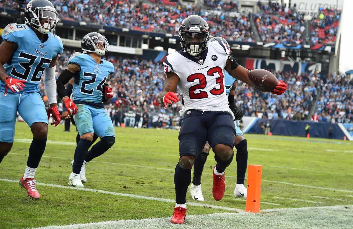 Texans running back Carlos Hyde (23) passes the pylon for a touchdown against the Titans during the 2019 season. With 1,070 yards on the ground, he became the most recent Houston player to rush for at least 1,000 yards in a season.