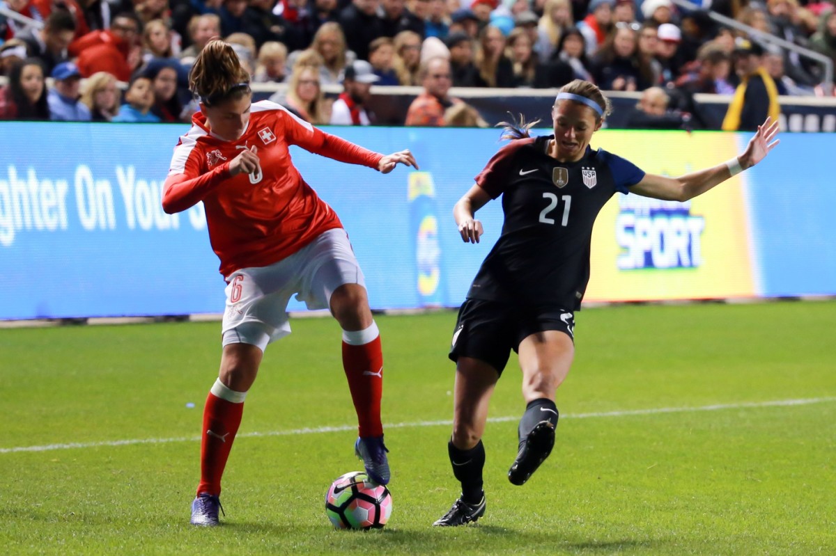 Oct 19, 2016; Sandy, UT, USA; United States forward Ashley Hatch (21) tries to stop Switzerland defender Selina Kuster (6) from passing the ball during the second half at Rio Tinto Stadium. United States won the game 4-0. Credit: Chris Nicoll-USA TODAY Sports