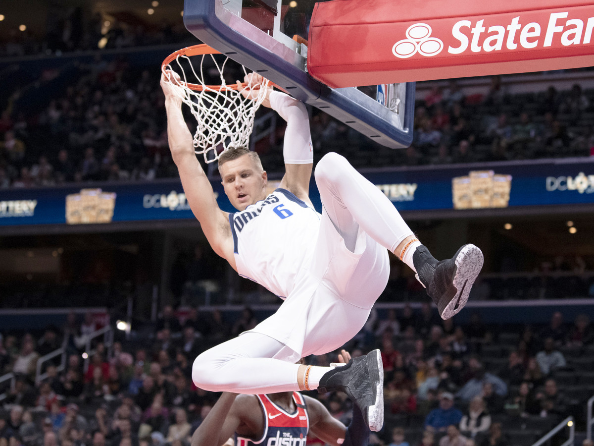 Feb 7, 2020; Washington, District of Columbia, USA;  Dallas Mavericks forward Kristaps Porzingis (6) dunks during the first half against the Washington Wizards at Capital One Arena.