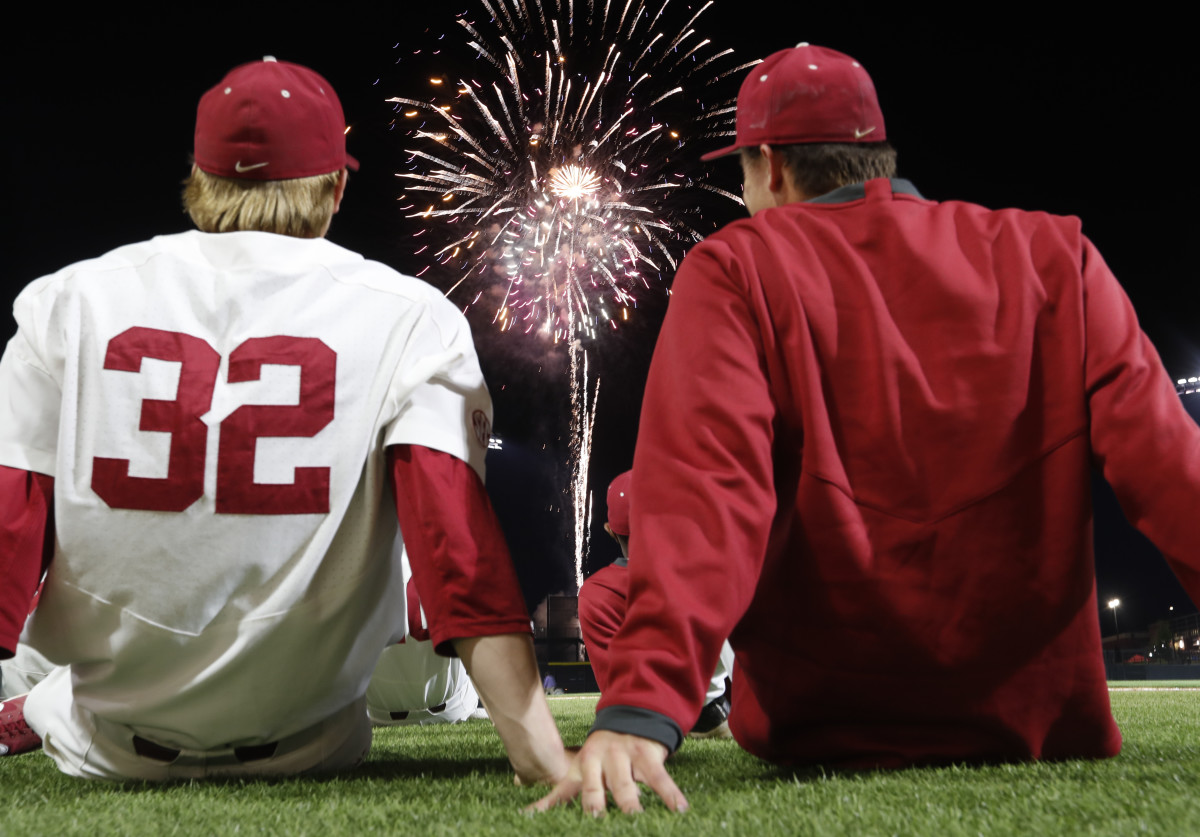Alabama baseball players watch fireworks at Sewell-Thomas Stadium in 2019