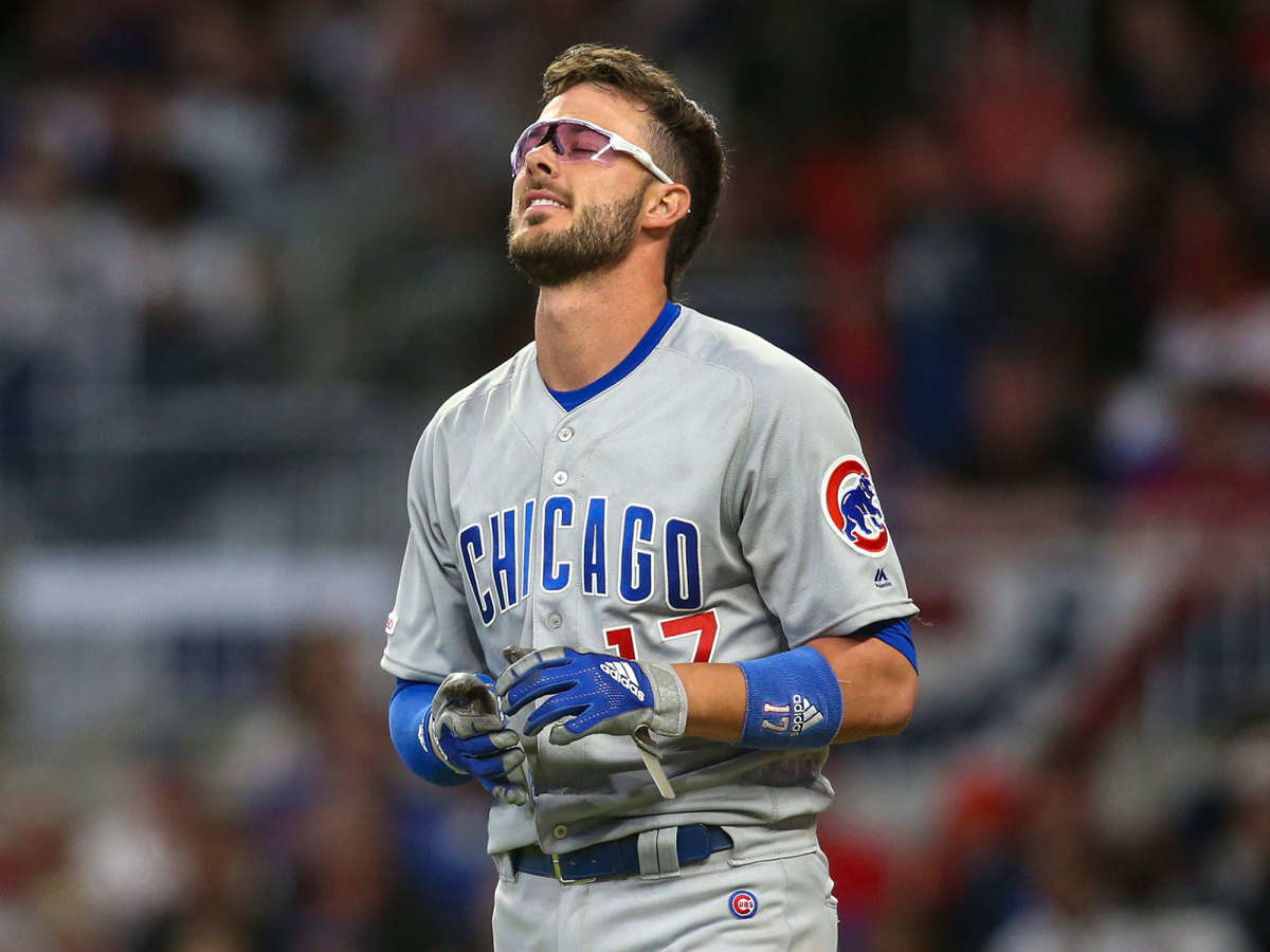 Kris Bryant grimaces after striking out