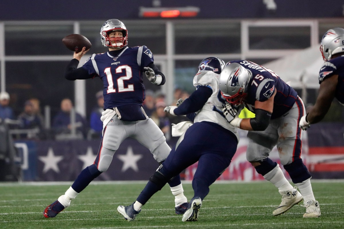 Jan 4, 2020; Foxborough, Massachusetts, USA; New England Patriots quarterback Tom Brady (12) throws during a playoff game against the Tennessee Titans at Gillette Stadium. Mandatory Credit: Winslow Townson-USA TODAY Sports