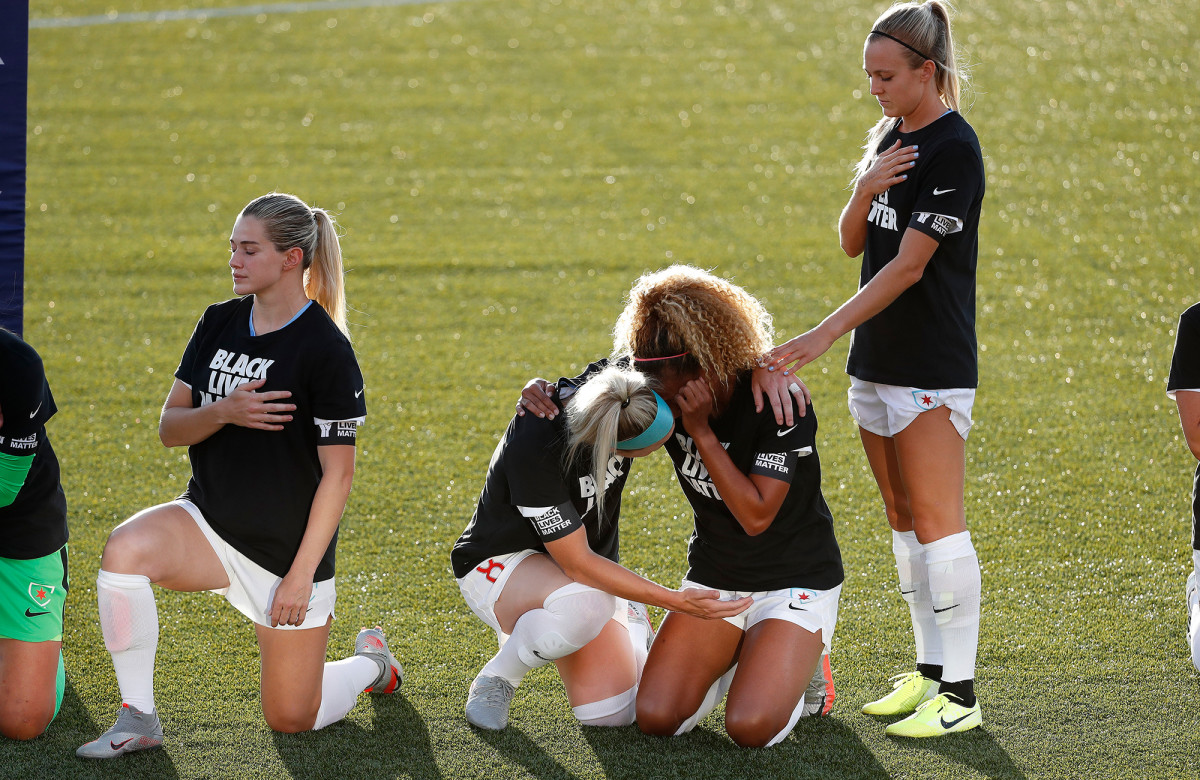 Julie Ertz consoles Casey Short
