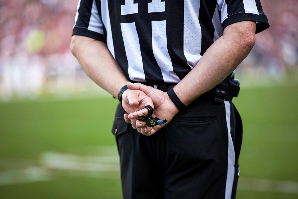 referee-hands-behind-back