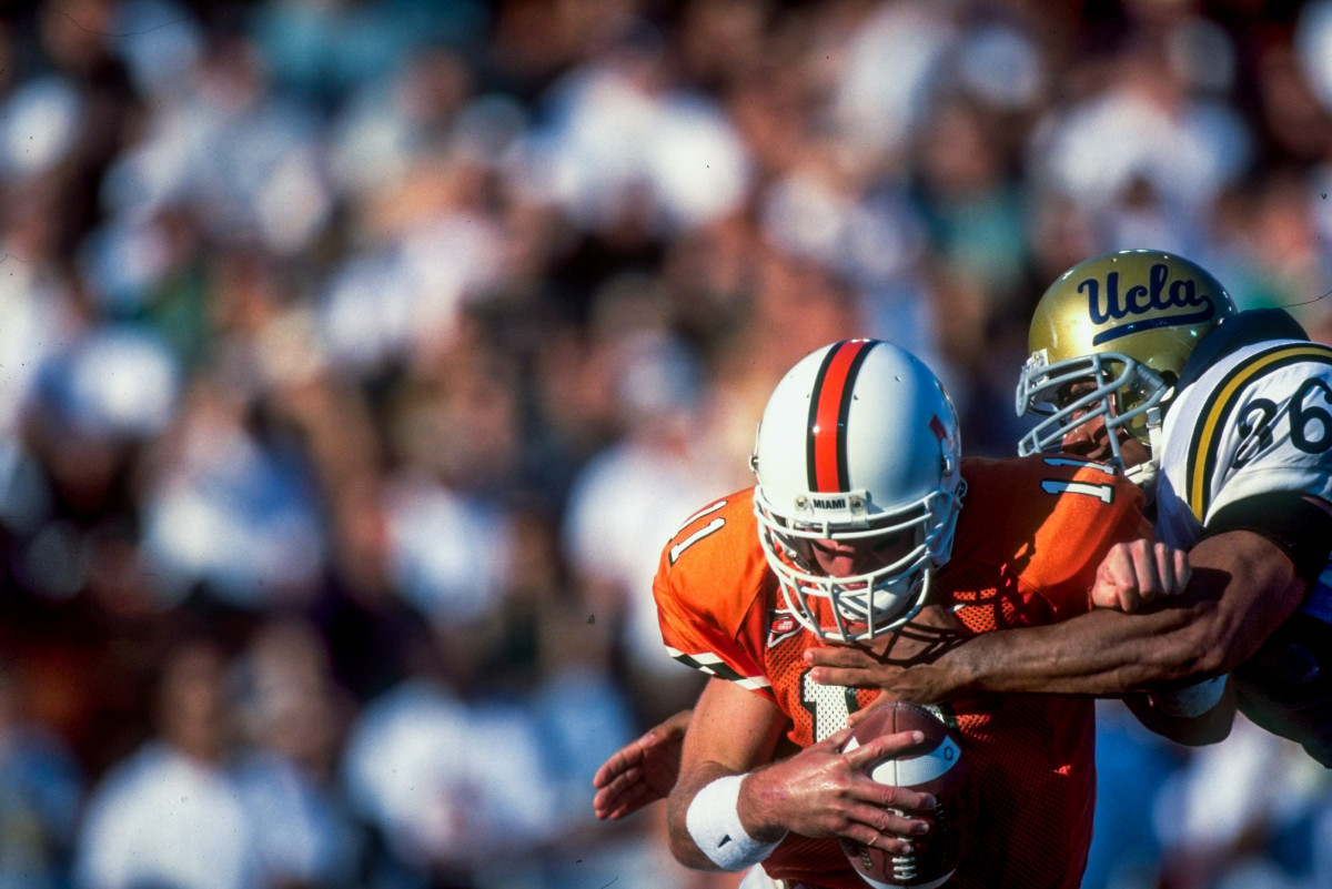 Huma, before his NCPA days, harasses Miami QB Scott Covington in 1998.