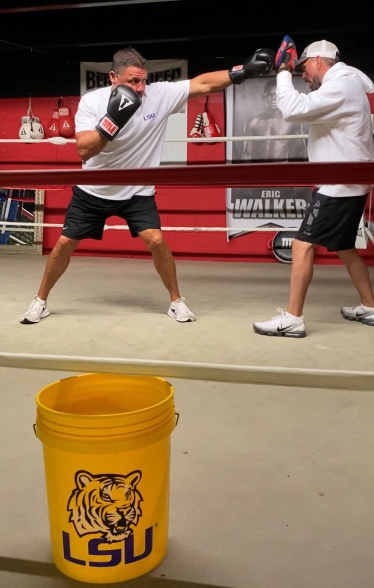 Ed Orgeron boxing with L.J. Morvant