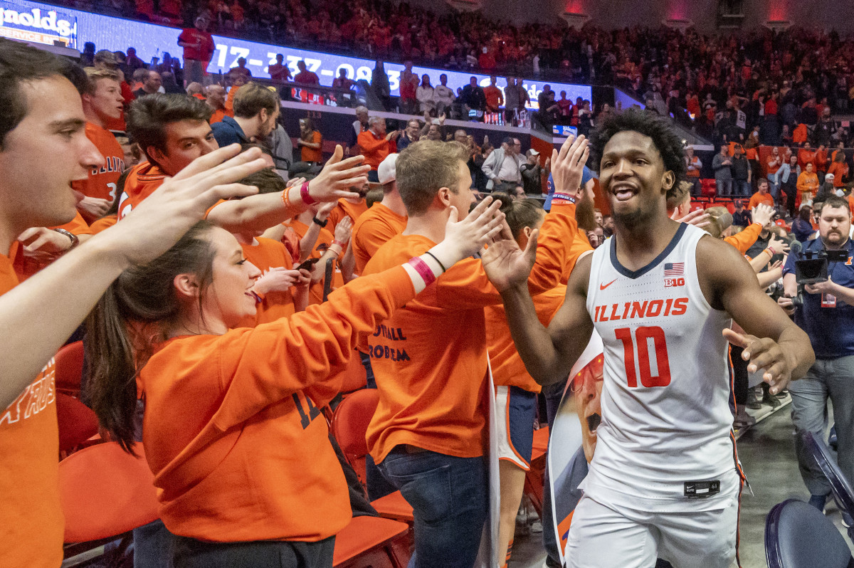 Illinois Fighting Illini guard Andres Feliz (10) celebrates with fans after a game against the Iowa Hawkeyes at State Farm Center.