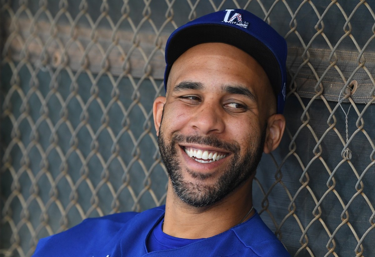 Feb 21, 2020; Glendale, Arizona, USA; Los Angeles Dodgers starting pitcher David Price (33) sits in the dugout during spring training at Camelback Ranch. Mandatory Credit: Jayne Kamin-Oncea-USA TODAY Sports