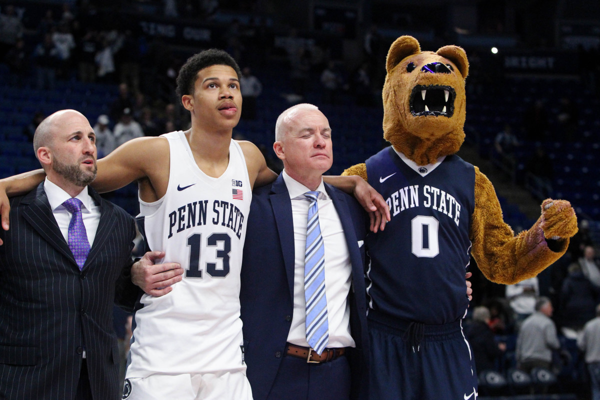 In this photo taken Feb. 27, 2019, Penn State associate head coach Keith Urgo (left), former guard Rasir Bolton (13) and head coach Patrick Chambers sing the alma mater after a game against Maryland. Matthew O'Haren-USA TODAY Sports