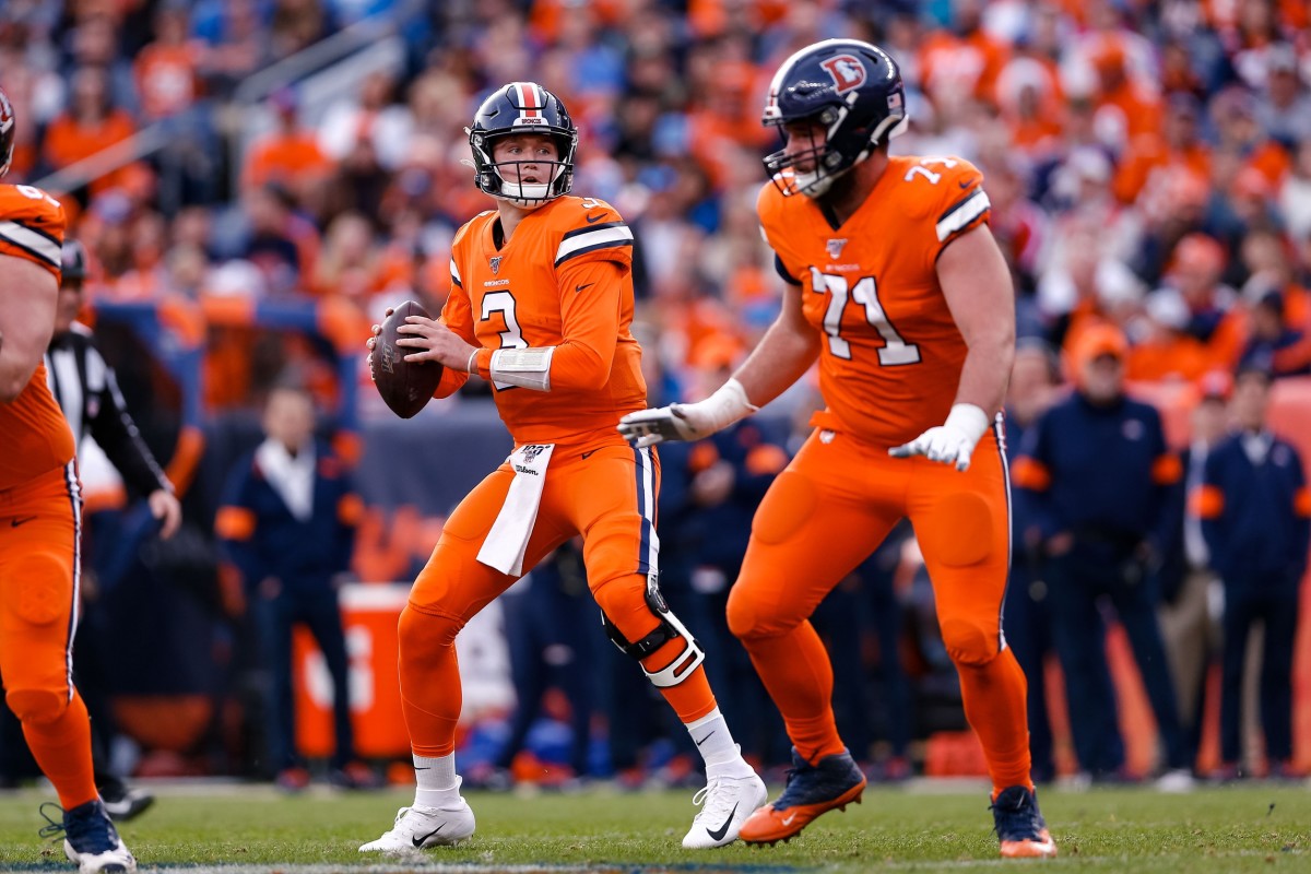 Dec 22, 2019; Denver, Colorado, USA; Denver Broncos quarterback Drew Lock (3) looks to pass as offensive guard Austin Schlottmann (71) defends in the second quarter against the Detroit Lions at Empower Field at Mile High. Mandatory Credit: Isaiah J. Downing-USA TODAY Sports