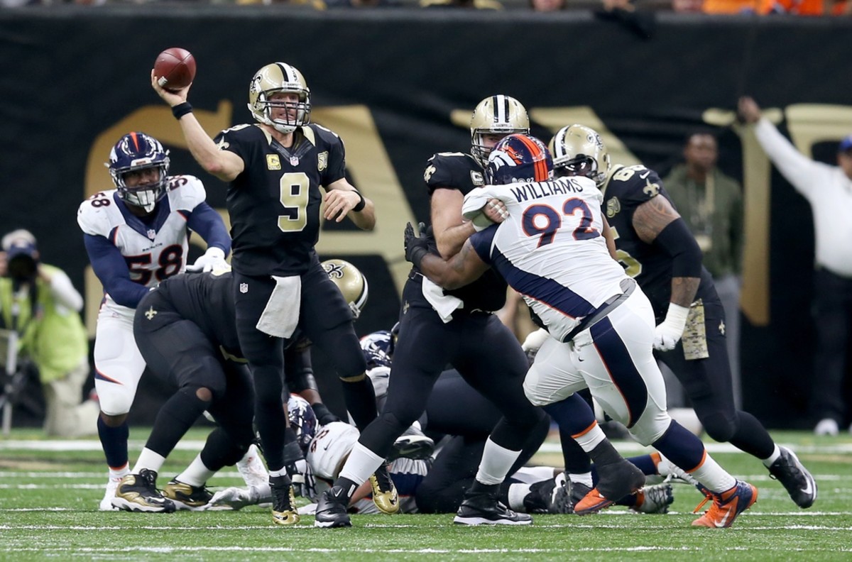Nov 13, 2016; New Orleans, LA, USA; New Orleans Saints quarterback Drew Brees (9) makes a throw against the Denver Broncos in the second half at the Mercedes-Benz Superdome. The Broncos won, 25-23. Mandatory Credit: Chuck Cook-USA TODAY Sports