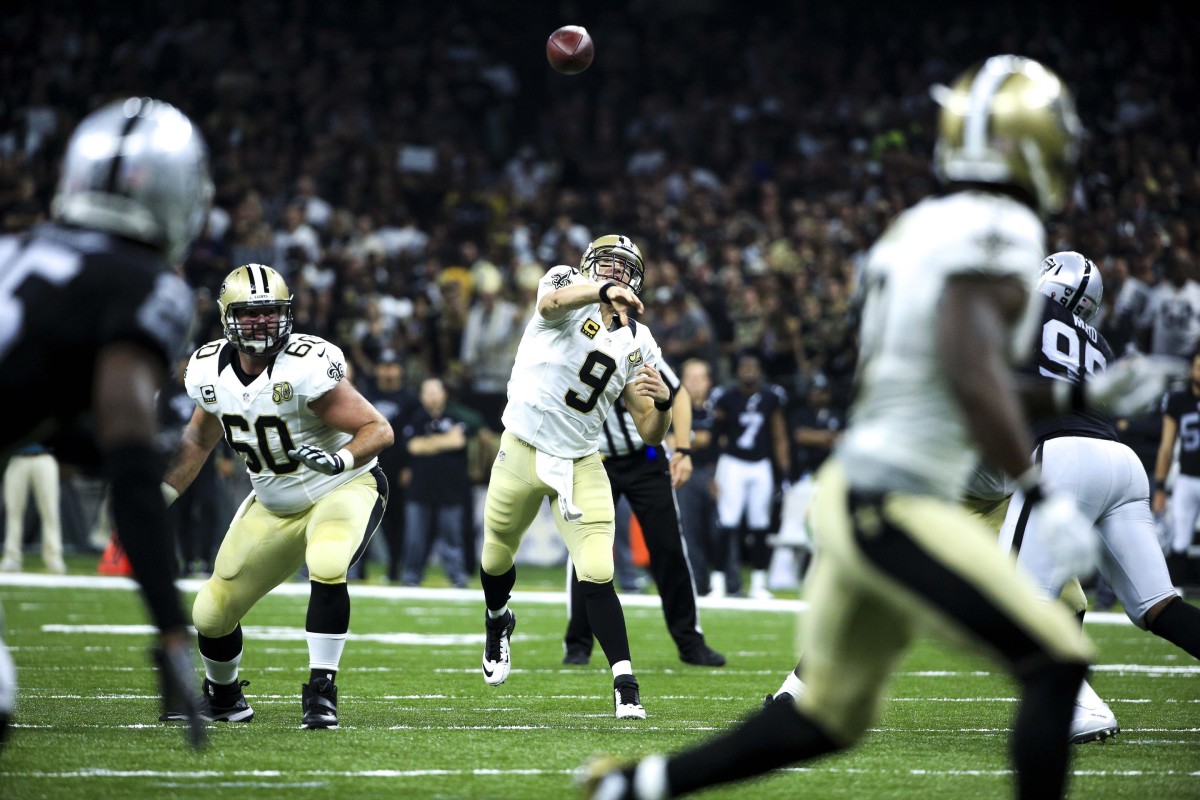 Sep 11, 2016; New Orleans, LA, USA; New Orleans Saints quarterback Drew Brees (9) throws a touchdown to wide receiver Brandin Cooks (10) during the second quarter of a game against the Oakland Raiders at the Mercedes-Benz Superdome. Mandatory Credit: Derick E. Hingle-USA TODAY Sports