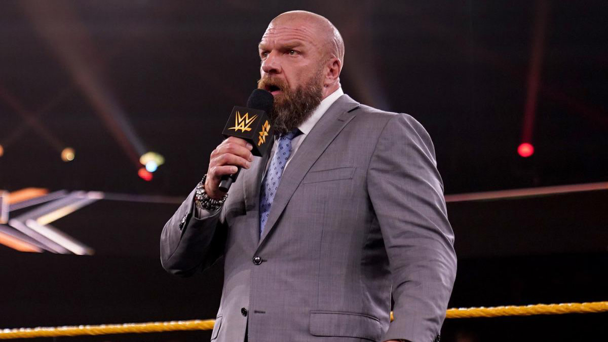 WWE's Paul 'Triple H' Levesque with a microphone on NXT