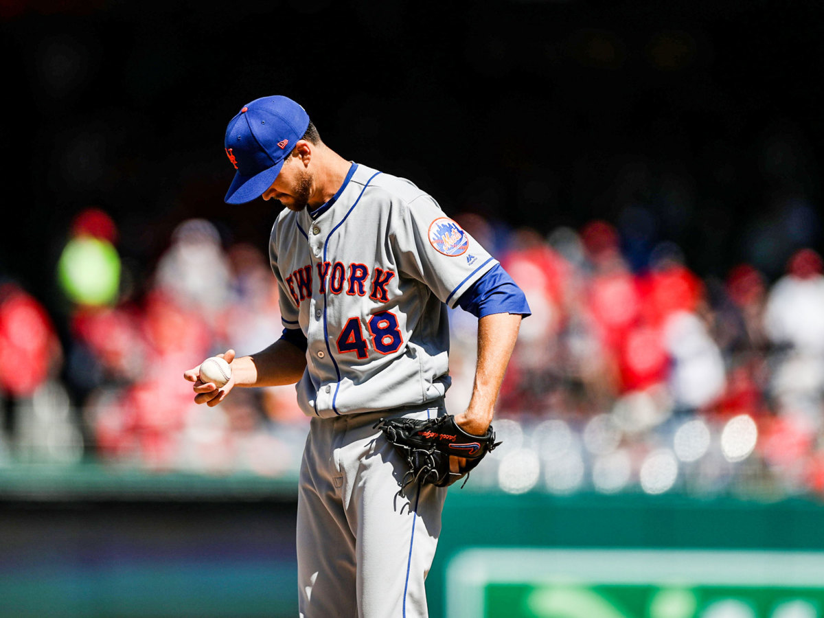 Jacob deGrom stands on the mound