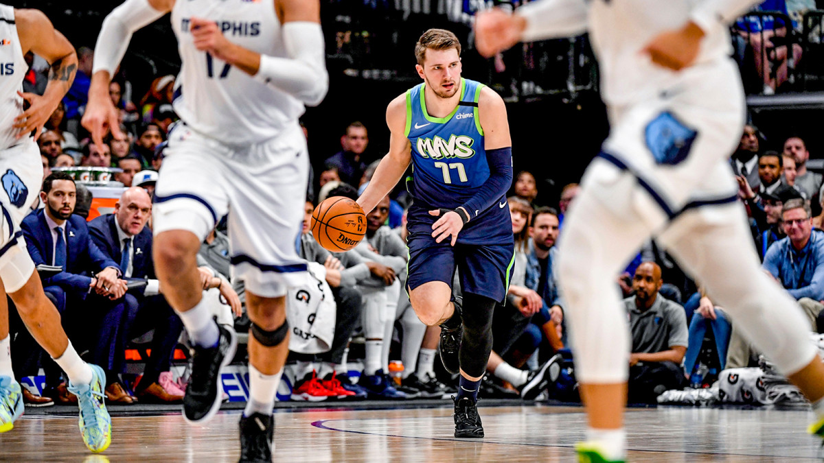 Luka Doncic brings the ball up the court against the Grizzlies