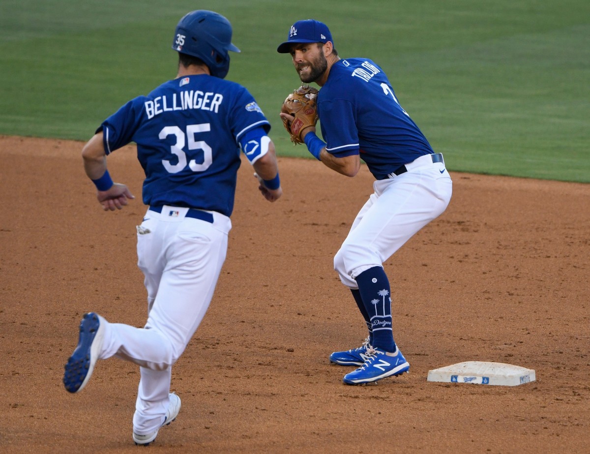 Jul 6, 2020; Los Angeles, California, United States; Los Angeles Dodgers second baseman Chris Taylor (3) forces out Los Angeles Dodgers center fielder Cody Bellinger (35) during an intrasquad game at Dodger Stadium. Mandatory Credit: Robert Hanashiro-USA TODAY Sports