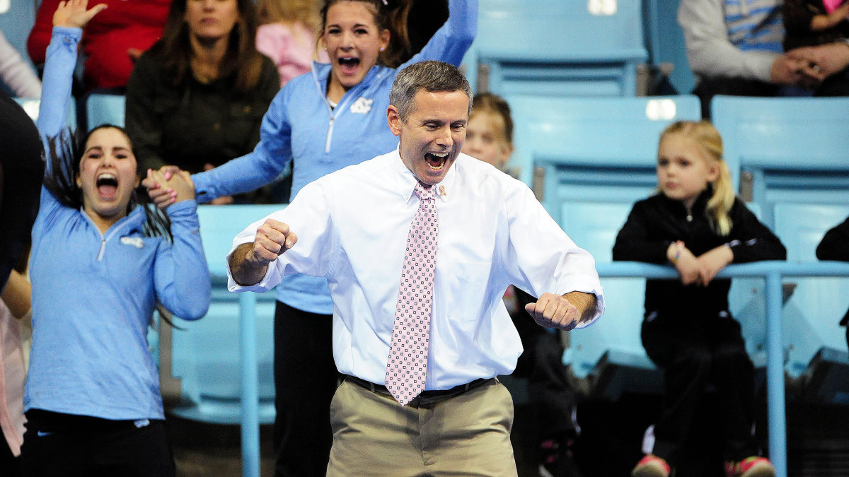 UNC gymnastics coach Derek Galvin celebrates