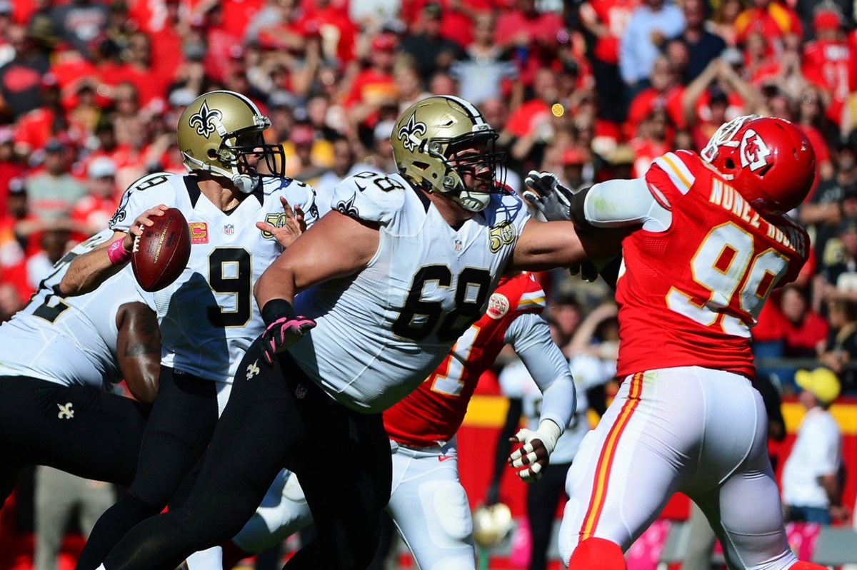 Oct 23, 2016; Kansas City, MO, USA; New Orleans Saints quarterback Drew Brees (9) looks to pass as offensive guard Tim Lelito (68) defends against Kansas City Chiefs defensive tackle Rakeem Nunez-Roches (99) during the second half at Arrowhead Stadium. The Chiefs won 27-21. Mandatory Credit: Jeff Curry-USA TODAY Sports