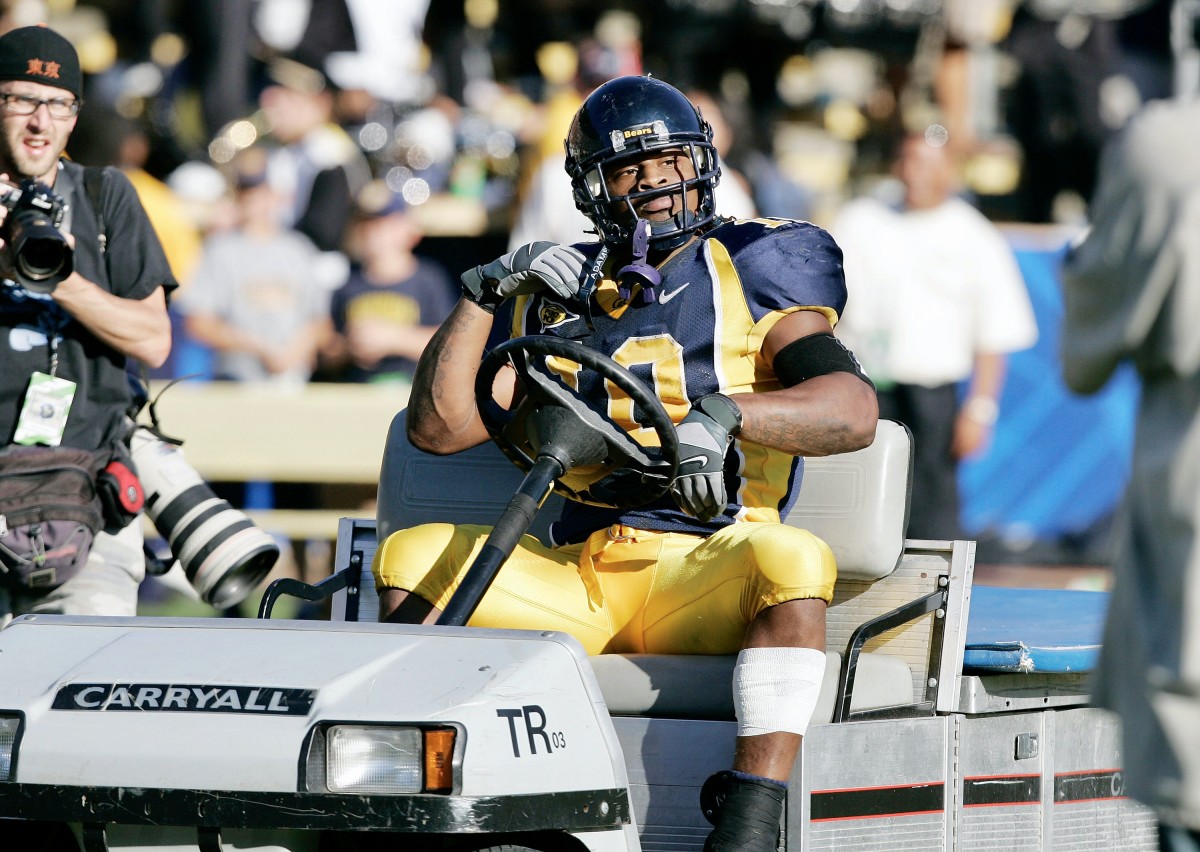 Former Cal running back Marshawn Lynch celebrates a victory in the equipment cart