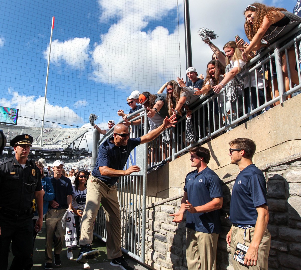 Penn State coach James Franklin celebrates with fans at Beaver Stadium.