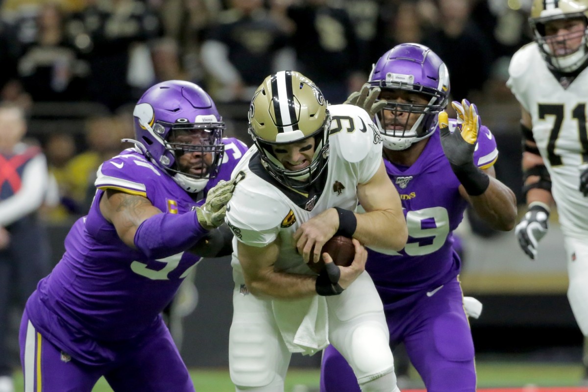 Jan 5, 2020; New Orleans, Louisiana, USA; Minnesota Vikings defensive end Everson Griffen (97) and defensive end Danielle Hunter (99) sack New Orleans Saints quarterback Drew Brees (9) during the first quarter of a NFC Wild Card playoff football game at the Mercedes-Benz Superdome. Mandatory Credit: Derick Hingle-USA TODAY Sports