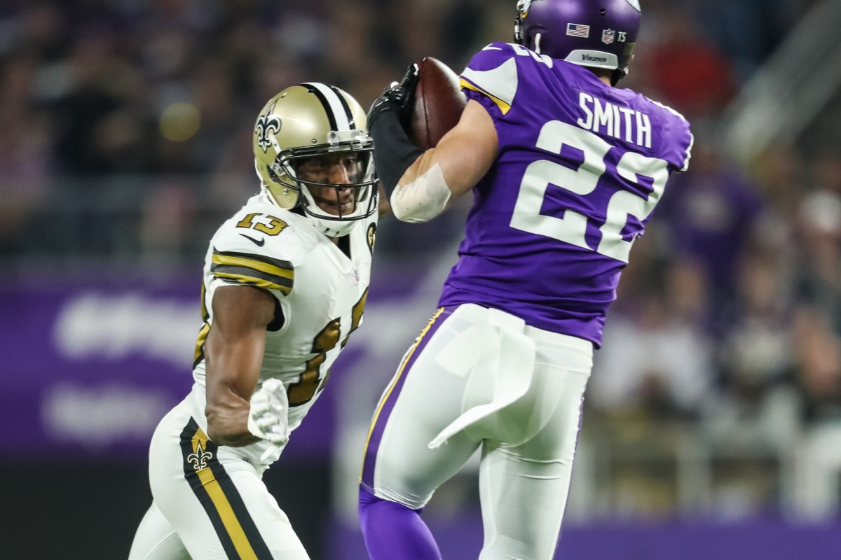 Oct 28, 2018; Minneapolis, MN, USA; Minnesota Vikings safety Harrison Smith (22) intercepts a pass in front of New Orleans Saints wide receiver Michael Thomas (13) during the second quarter at U.S. Bank Stadium. Mandatory Credit: Brace Hemmelgarn-USA TODAY Sports