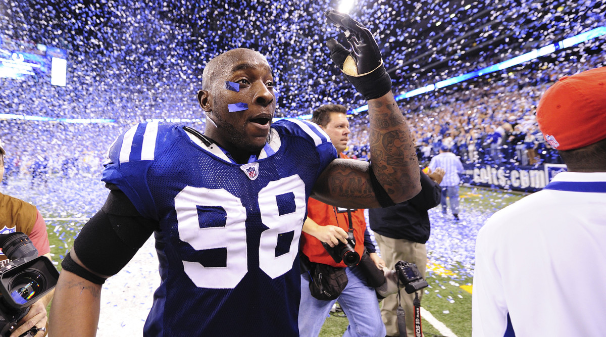 Robert Mathis leaves the field after a Colts win
