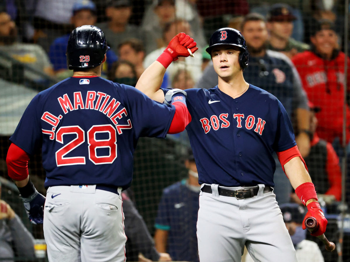 Sep 14, 2021; Seattle, Washington, USA; Boston Red Sox left fielder J.D. Martinez (28) celebrates his solo home run with Boston Red Sox first baseman Bobby Dalbec (29) against the Seattle Mariners in the fourth inning at T-Mobile Park.