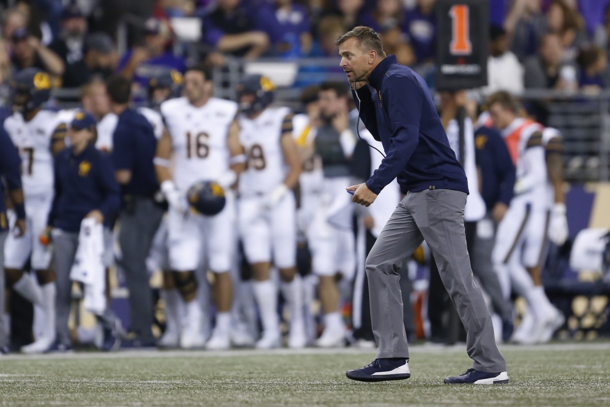 Cal coach Justin Wilcox, a former UW assistant, heads for the locker room when the game was delayed in 2019.