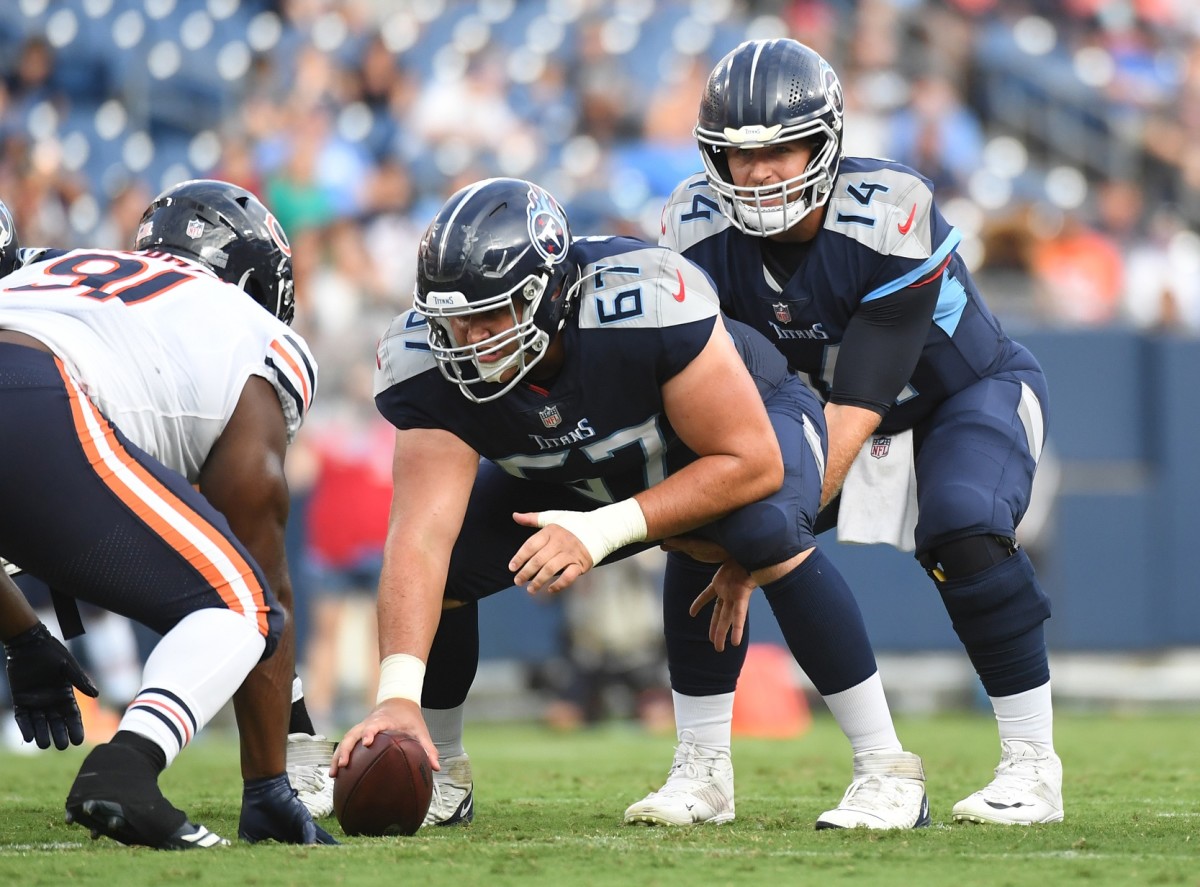 Aug 28, 2021; Nashville, TN, USA; Tennessee Titans quarterback Matt Barkley (14) takes the snap from Tennessee Titans center Cole Banwart (67) during the first half against the Chicago Bears at Nissan Stadium.