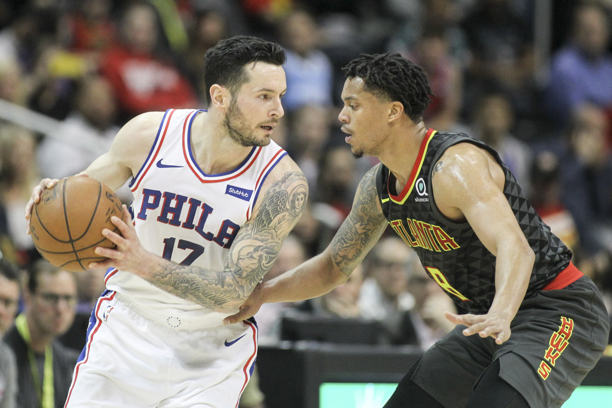Philadelphia 76ers guard JJ Redick (17) is defended by Atlanta Hawks guard Damion Lee (8) in the fourth quarter at Philips Arena.