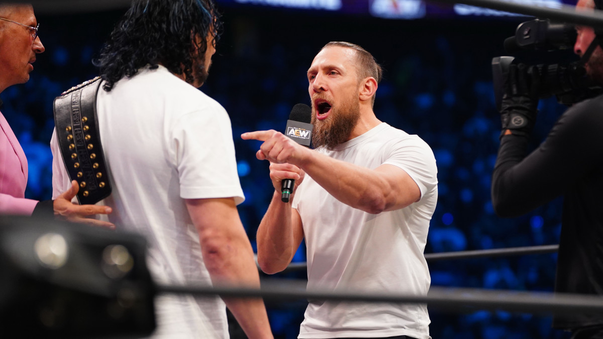 Bryan Danielson thrusts his finger in Kenny Omega's chest during a promo