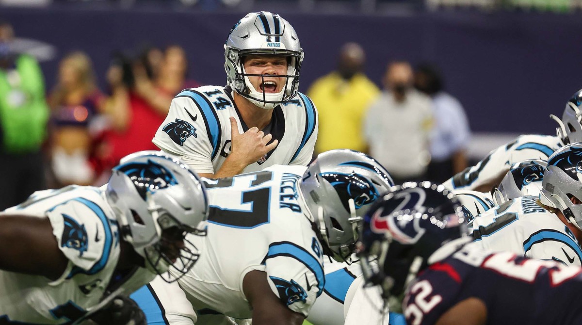 Sep 23, 2021; Houston, Texas, USA; Carolina Panthers quarterback Sam Darnold (14) calls a play at the line of scrimmage during the first quarter against the Houston Texans at NRG Stadium.