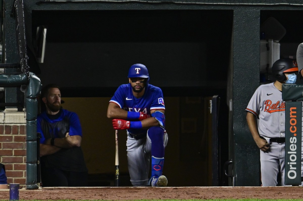 Sep 23, 2021; Baltimore, Maryland, USA; Texas Rangers center fielder Leody Taveras (3) looks onto the field from the dugout while awaiting a fifth inning at bat against the Baltimore Orioles at Oriole Park at Camden Yards. Mandatory Credit: Tommy Gilligan-USA TODAY Sports