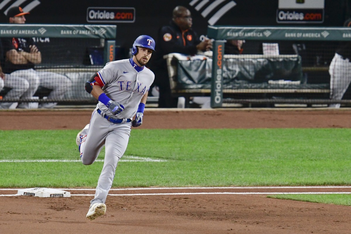 Sep 24, 2021; Baltimore, Maryland, USA; Texas Rangers first baseman Nathaniel Lowe (30) runs out a \1i] home run against the Baltimore Orioles at Oriole Park at Camden Yards.