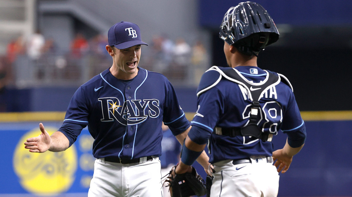 Sep 22, 2021; St. Petersburg, Florida, USA; Tampa Bay Rays relief pitcher David Robertson (30) and Tampa Bay Rays catcher Francisco Mejia (28) celebrate as they beat the Toronto Blue Jays to clinch a playoff spot at Tropicana Field.