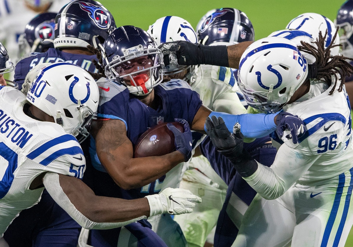 D'Onta Foreman of the Titans is bottled up by Colts players, Indianapolis Colts at Tennessee Titans, Nissan Stadium, Nashville, Thursday, Nov. 12, 2020. Colts won 34-17.