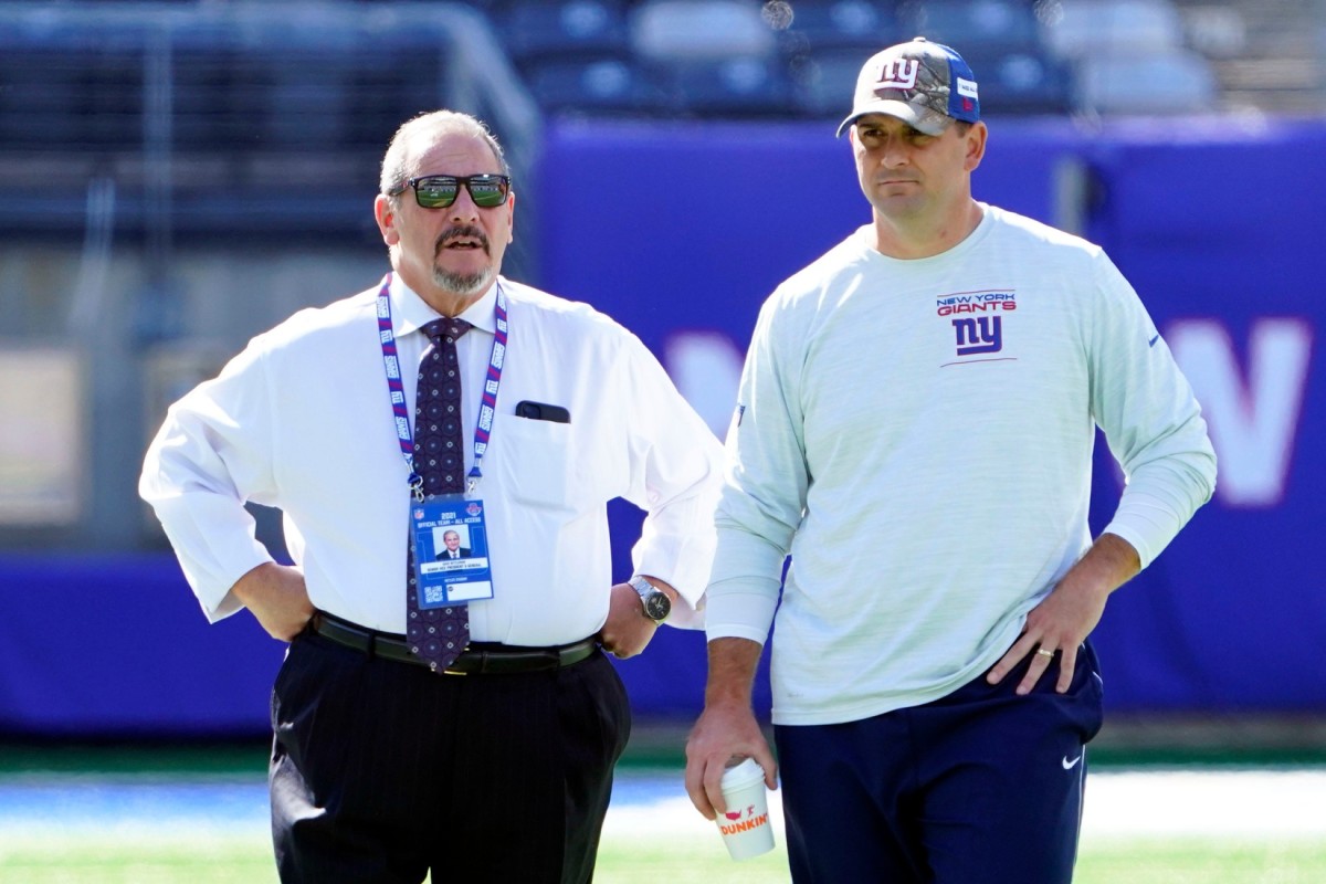 New York Giants general manager Dave Gettleman, left, and head coach Joe Judge talk on the field before the game at MetLife Stadium on Sunday, Sept. 26, 2021, in East Rutherford.