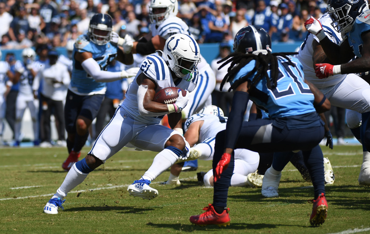 Sep 26, 2021; Nashville, Tennessee, USA; Indianapolis Colts running back Nyheim Hines (21) runs for a first down during the first half against the Tennessee Titans at Nissan Stadium.