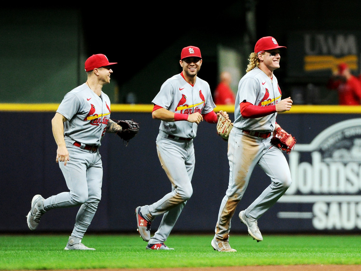 Sep 20, 2021; Milwaukee, Wisconsin, USA;  St. Louis Cardinals left fielder Tyler O'Neill (27) and right fielder Dylan Carlson (3) and center fielder Harrison Bader (48) celebrate after defeating the Milwaukee Brewers at American Family Field.