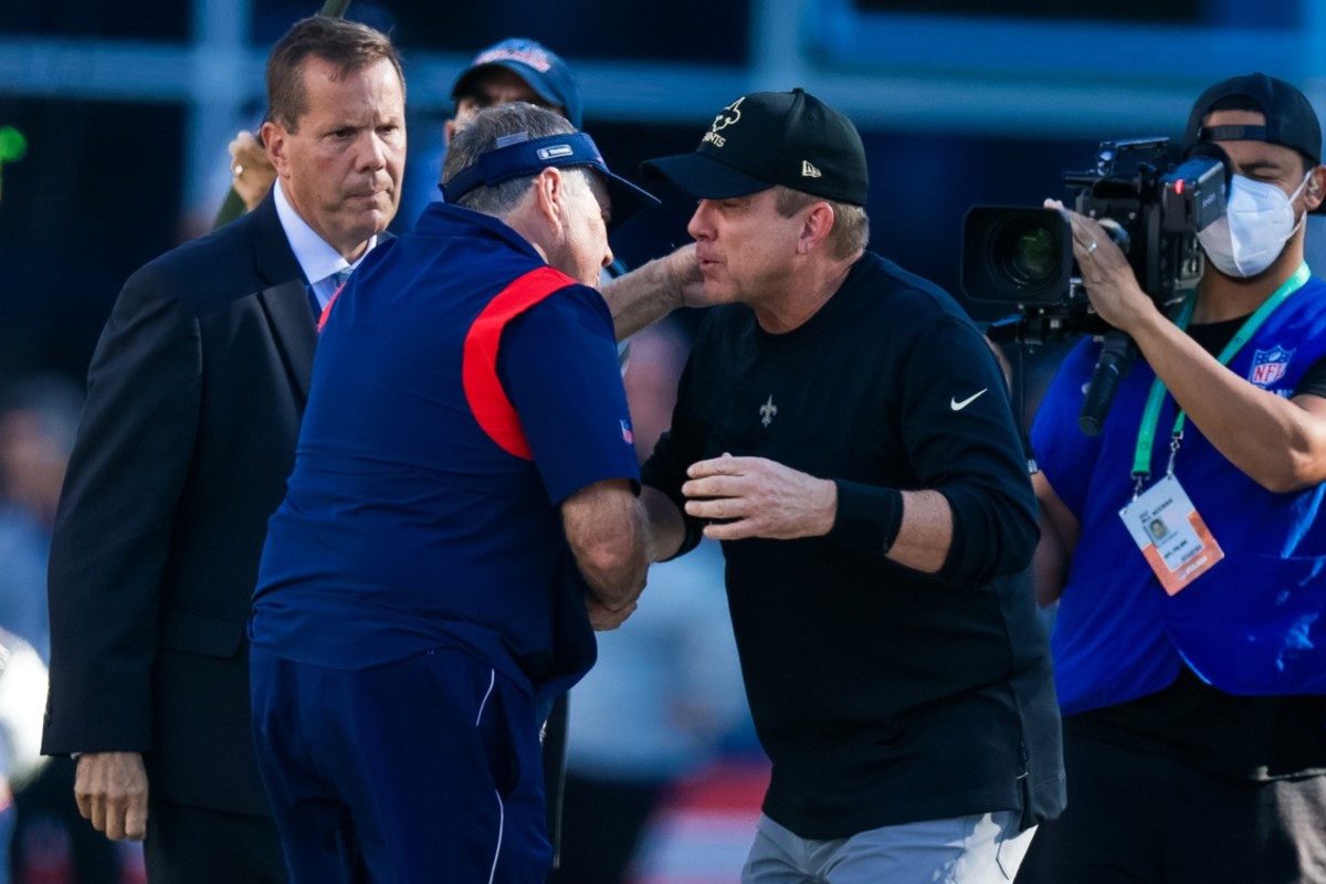 New England Patriots head coach Bill Belichick hugs New Orleans Saints head coach Sean Payton
