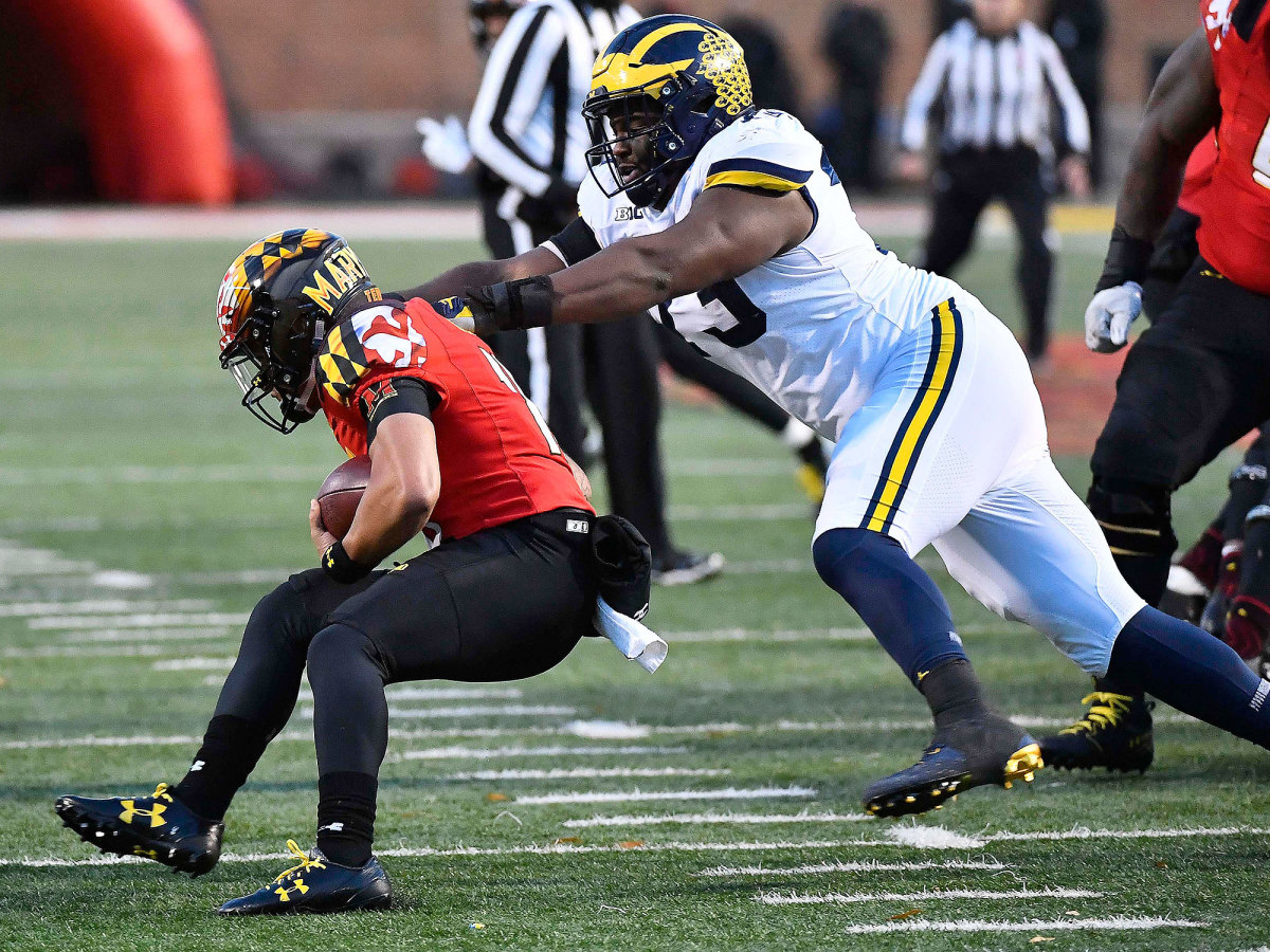 Maryland QB Ryan Brand is tackled by Michigan in 2017