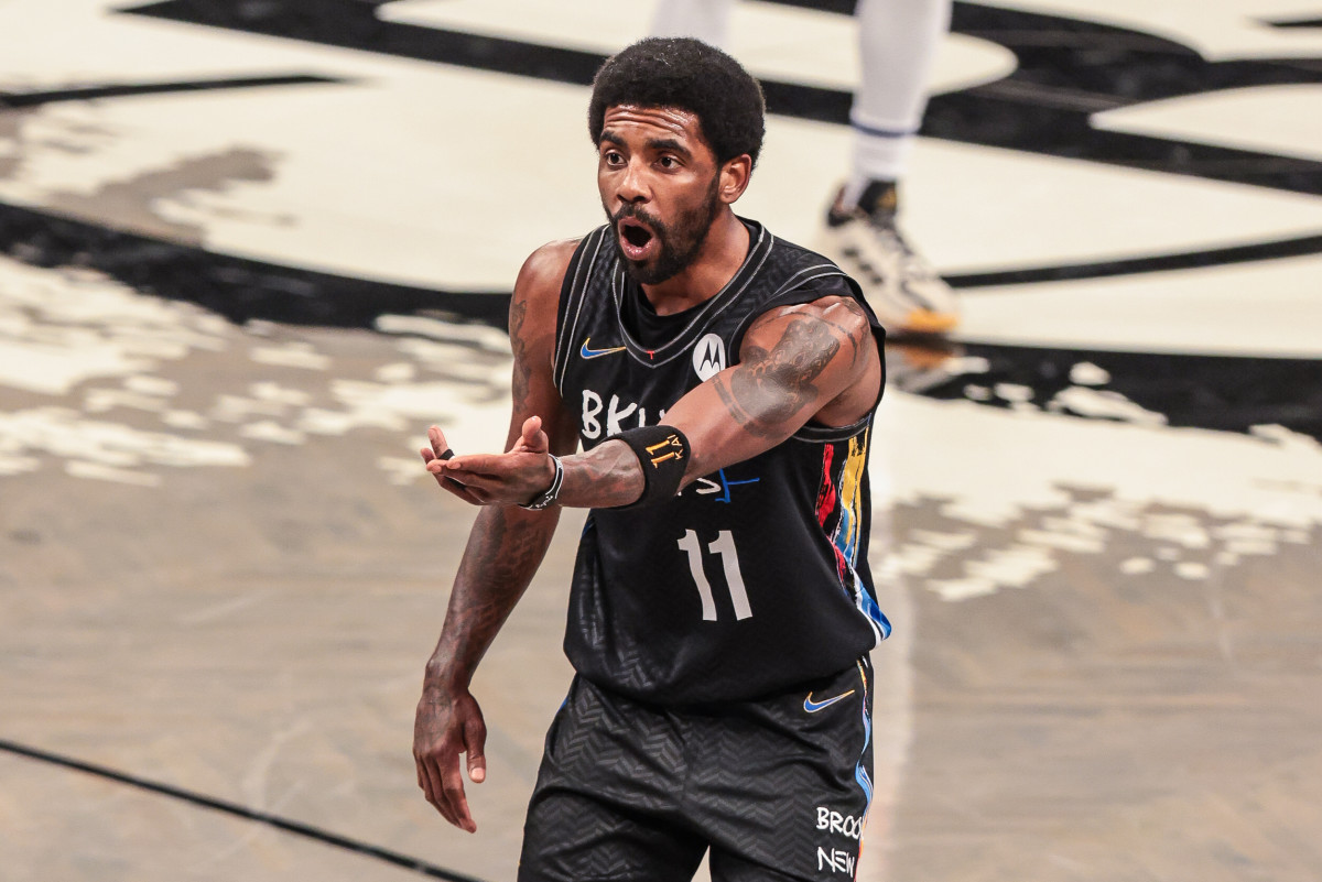 Brooklyn Nets guard Kyrie Irving (11) reacts after a call during the second half against the New York Knicks at Barclays Center.