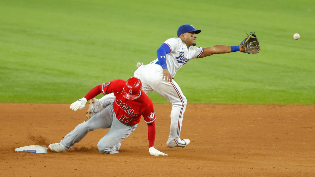 Sep 29, 2021; Arlington, Texas, USA; Los Angeles Angels designated hitter Shohei Ohtani (17) slides into second base with Texas Rangers second baseman Andy Ibanez (77) covering during the sixth inning at Globe Life Field. Mandatory Credit: Andrew Dieb-USA TODAY Sports