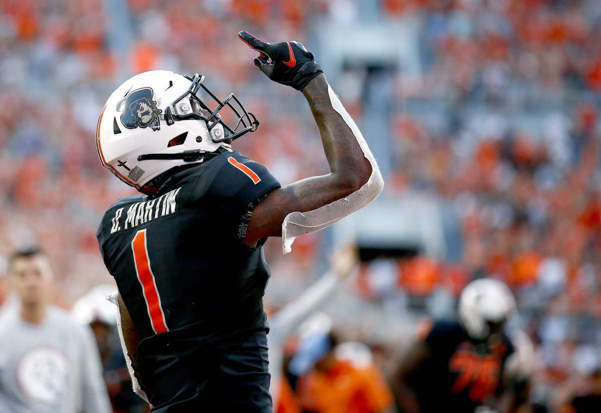 Sep 25, 2021; Stillwater, Oklahoma, USA; Oklahoma State Cowboys wide receiver Tay Martin (1) celebrates after catching a touchdown pass against the Kansas State Wildcats in the second quarter at Boone Pickens Stadium.