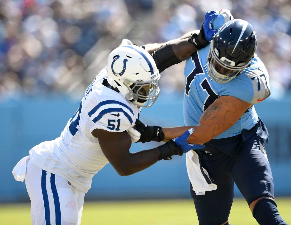 Tennessee Titans offensive tackle Taylor Lewan (77) blocks Indianapolis Colts defensive end Kwity Paye (51) during the first quarter at Nissan Stadium Sunday, Sept. 26, 2021 in Nashville, Tenn. Titans Colts 089