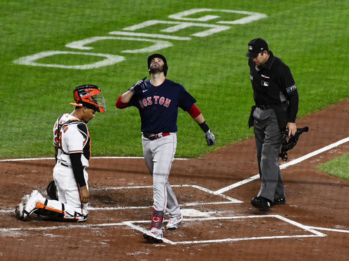 Sep 29, 2021; Baltimore, Maryland, USA;  Boston Red Sox left fielder J.D. Martinez (28) celebrates hitting a second inning solo home run as Baltimore Orioles catcher Pedro Severino (28) looks on at Oriole Park at Camden Yards.