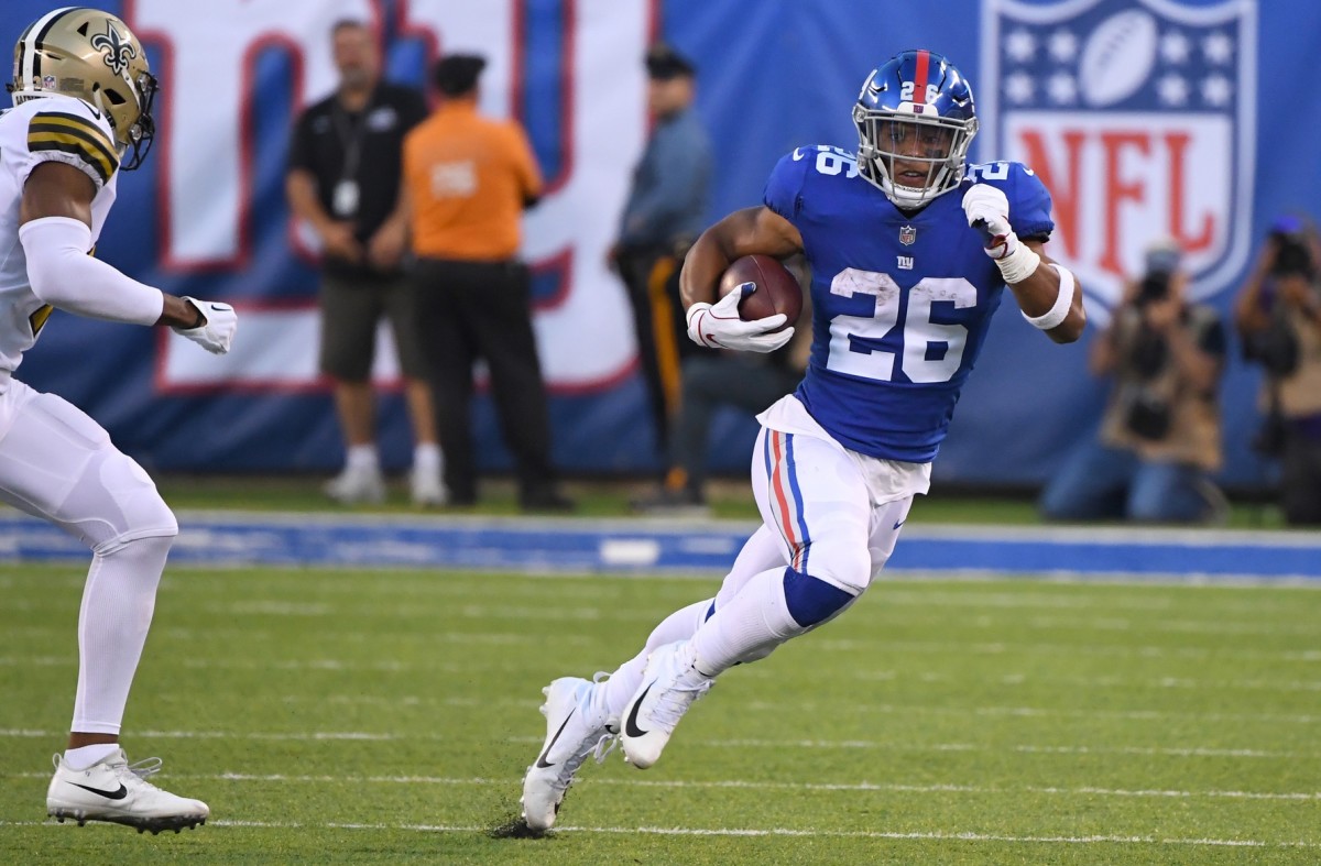 New York Giants running back Saquon Barkley (26) carries the ball past New Orleans safety Marcus Williams (43). Mandatory Credit: Robert Deutsch-USA TODAY Sports
