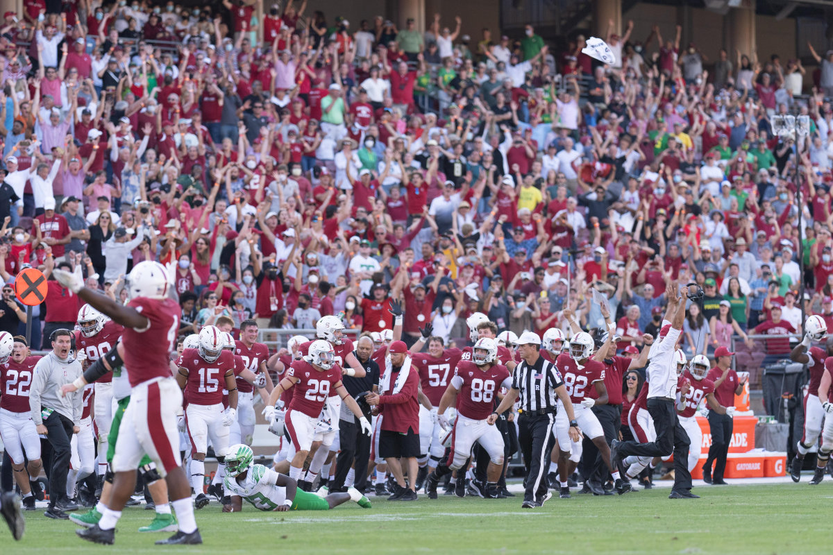 Stanford players and fans erupt with celebration after defeating the Oregon Ducks.